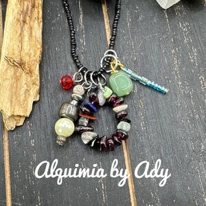 Bohemian charms and garnet eclectic necklace